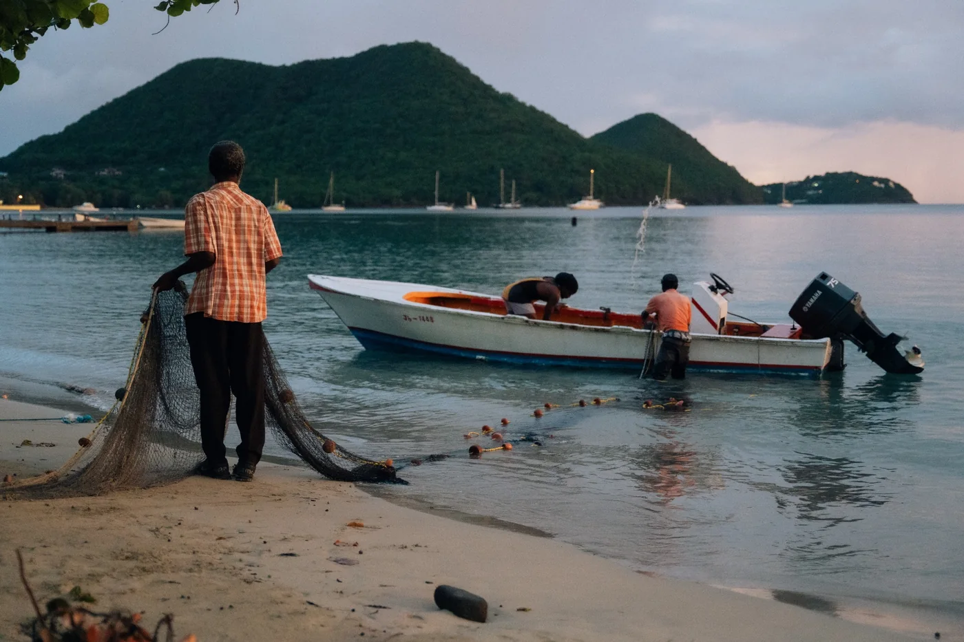 Fishermen working near the shoreline in Saint Lucia